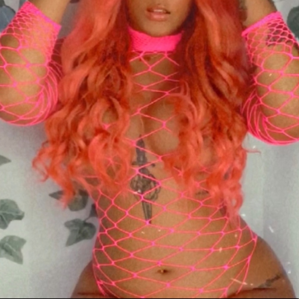 Pink fishnet long sleeve bodysuit